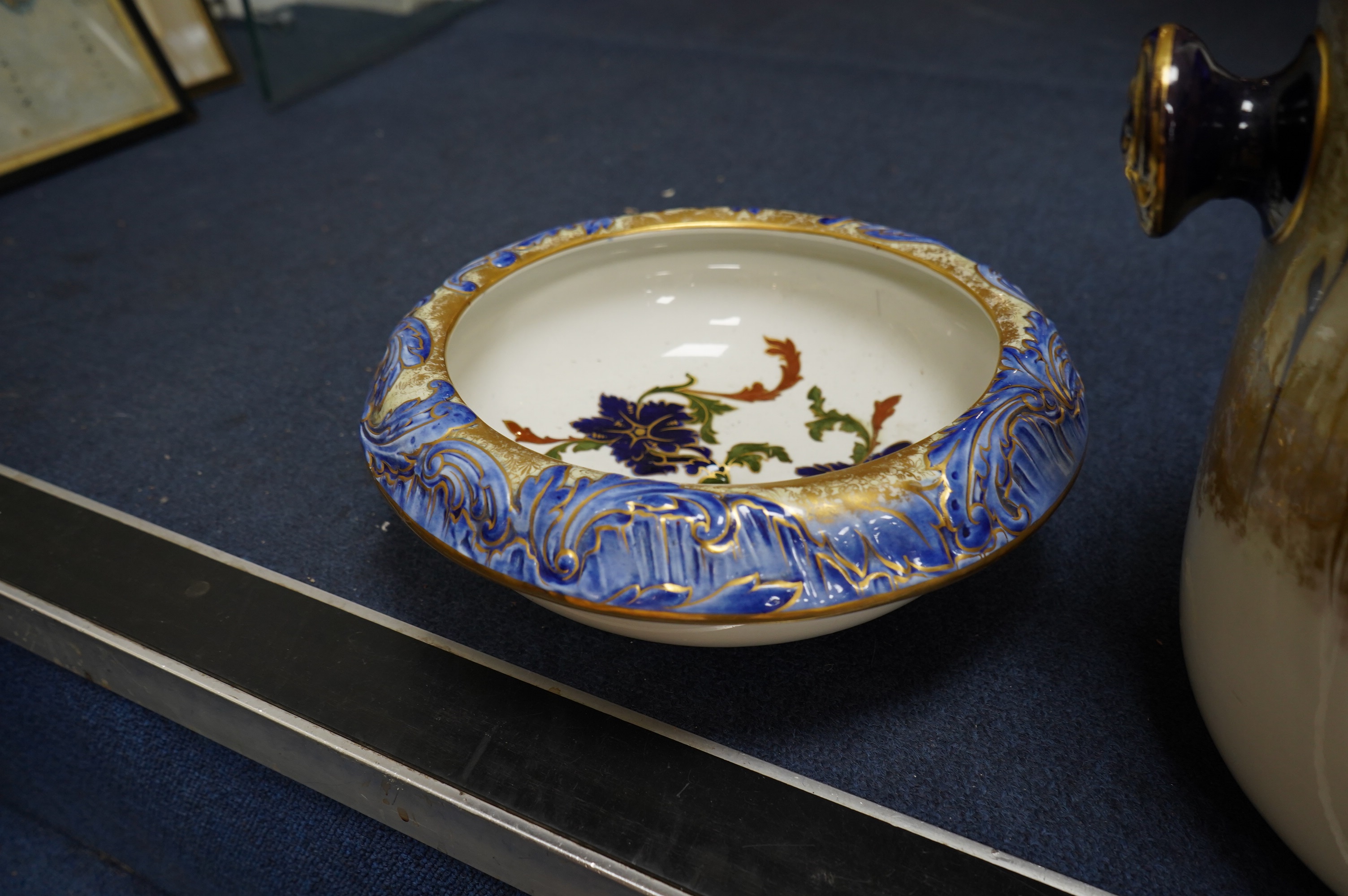 A Victorian Royal Doulton gilt and floral decorated pail, 28cm high. Condition - poor, crack to back
